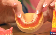 Example of dentures are displayed up close. 